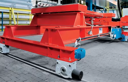 Transfer car for aluminum bar equipped with Demag wheel block system and gear motors.